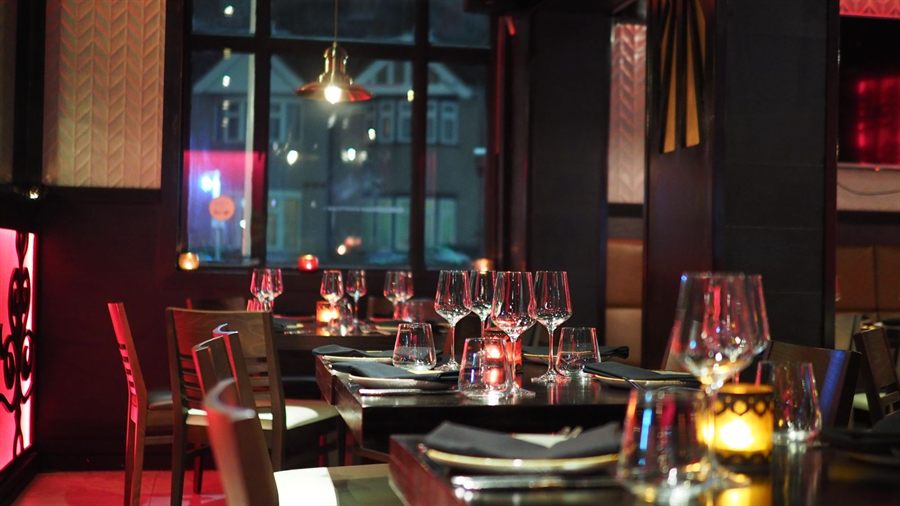 Restaurant tables set for dinner